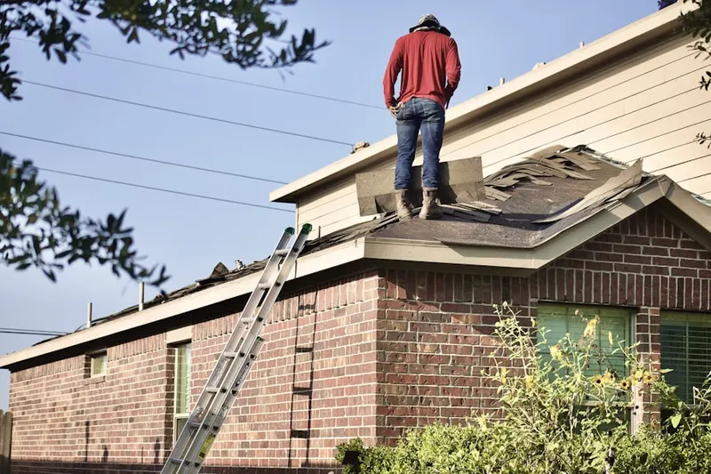 Professional roofer working on a residential roof in Desert Horizons